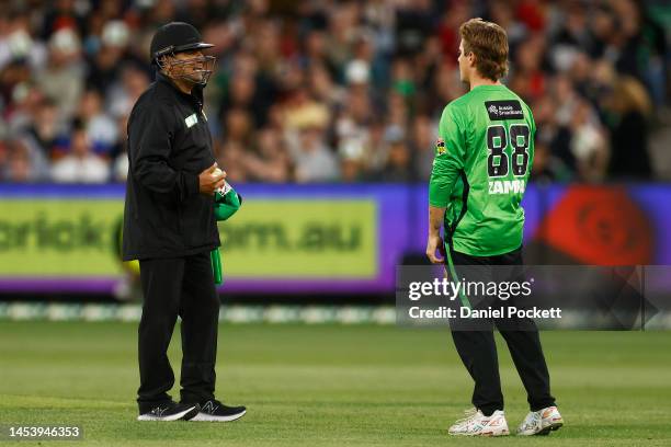 The umpire chats with Adam Zampa of the Stars after he attempted run Tom Rogers of the Renegades out for leaving his crease during a bowling action...