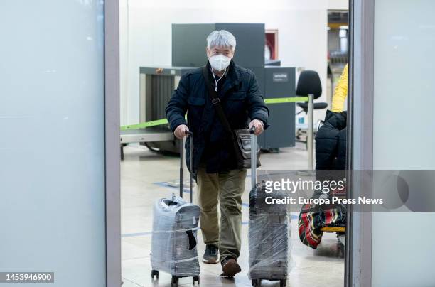 Passenger arrives at Adolfo Suarez Madrid-Barajas airport from a flight from Chongqing , January 3 in Madrid, Spain. Terminal 1 of Adolfo Suarez...