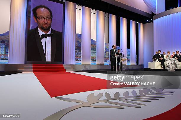 Mexican director Carlos Reygadas speaks on stage after being awarded with the Best Director award for his film "Post Tenebras Lux" during the closing...