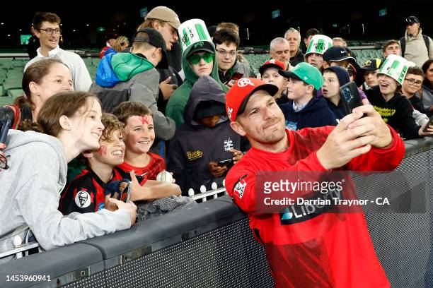 Aaron Finch of the Melbourne Renegades takes a photo with fans after the Men's Big Bash League match between the Melbourne Stars and the Melbourne...
