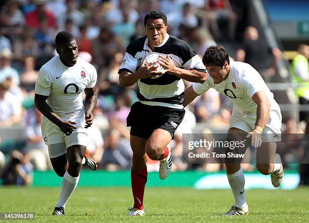 Mils Muliaina of The Barbarians makes a break during the Killik Cup match between England and The Barbarians at Twickenham Stadium on May 27, 2012 in...