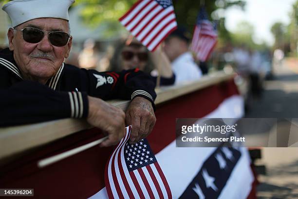 World War Two Navy veteran Edward Sabo rides on a float in the annual Memorial Day Parade on May 28, 2012 in Fairfield, Connecticut. Across America...