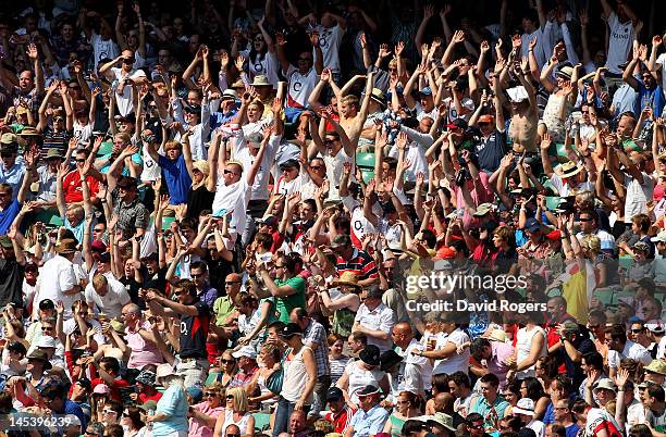 Fans enjoy the atmosphere during the Killik Cup match between England and The Barbarians at Twickenham Stadium on May 27, 2012 in London, England.