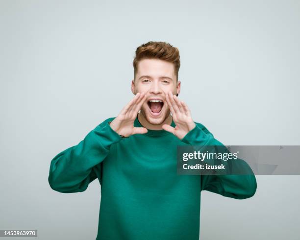 young volunteer shouting at camera - man excited face stock pictures, royalty-free photos & images