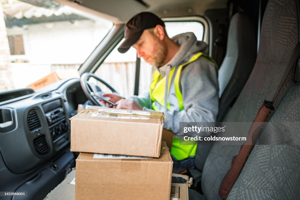 Delivery Rider Behind Lorry Delivery Driver In Van With Parcels On Seat High-Res Stock Photo ...