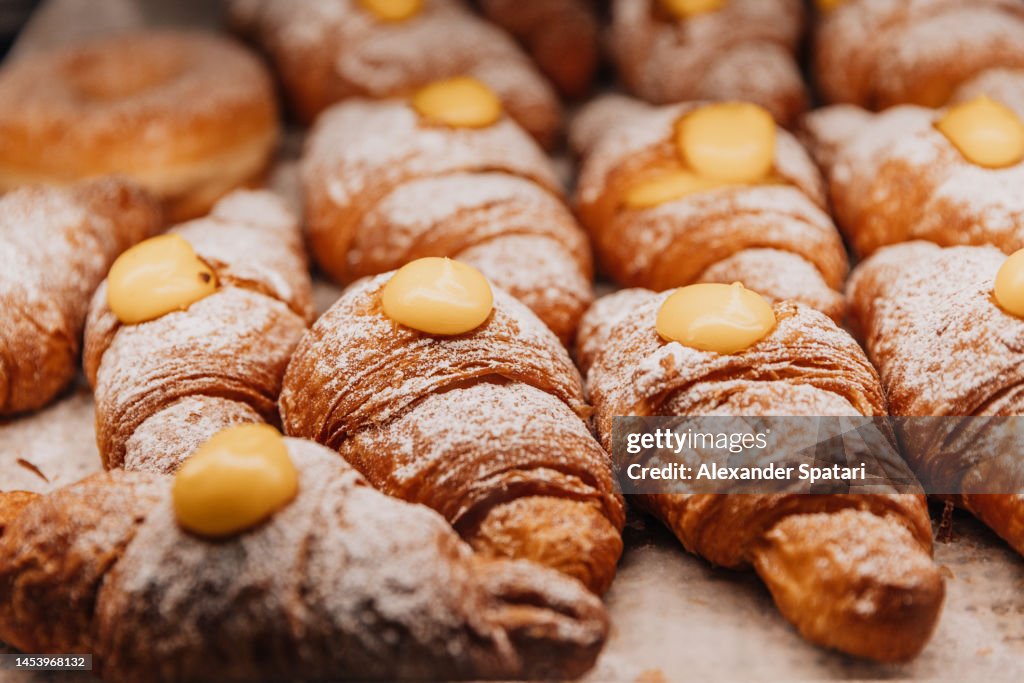 Cornetti croissants with creme at the bakery close-up