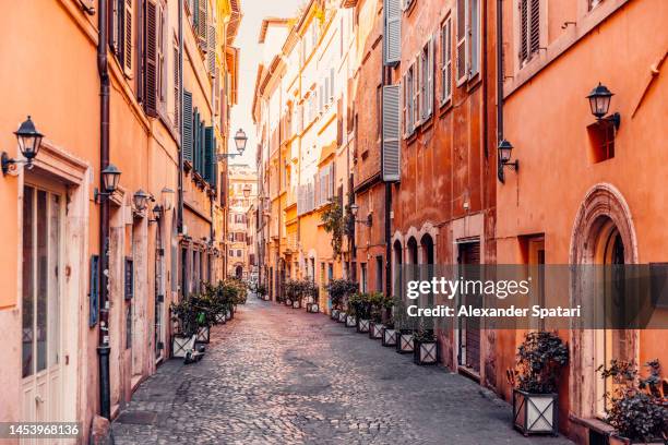 empty street in rome on a sunny day, italy - trastevere stock pictures, royalty-free photos & images