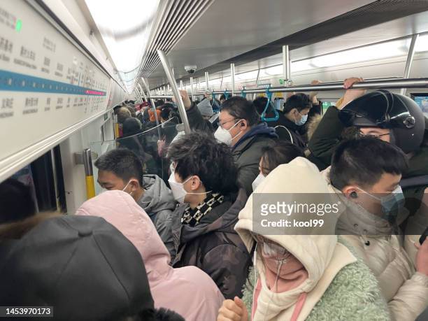 passengers in the beijing subway - crowded public transport stock pictures, royalty-free photos & images