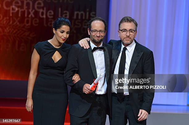 Mexican director Carlos Reygadas poses on stage with French actress Leila Bekhti and British actor and President of the Un Certain Regard jury Tim...