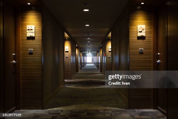 the corridor in modern apartment, hotel with warm, yellpwing lighting - hotel hallway stock pictures, royalty-free photos & images