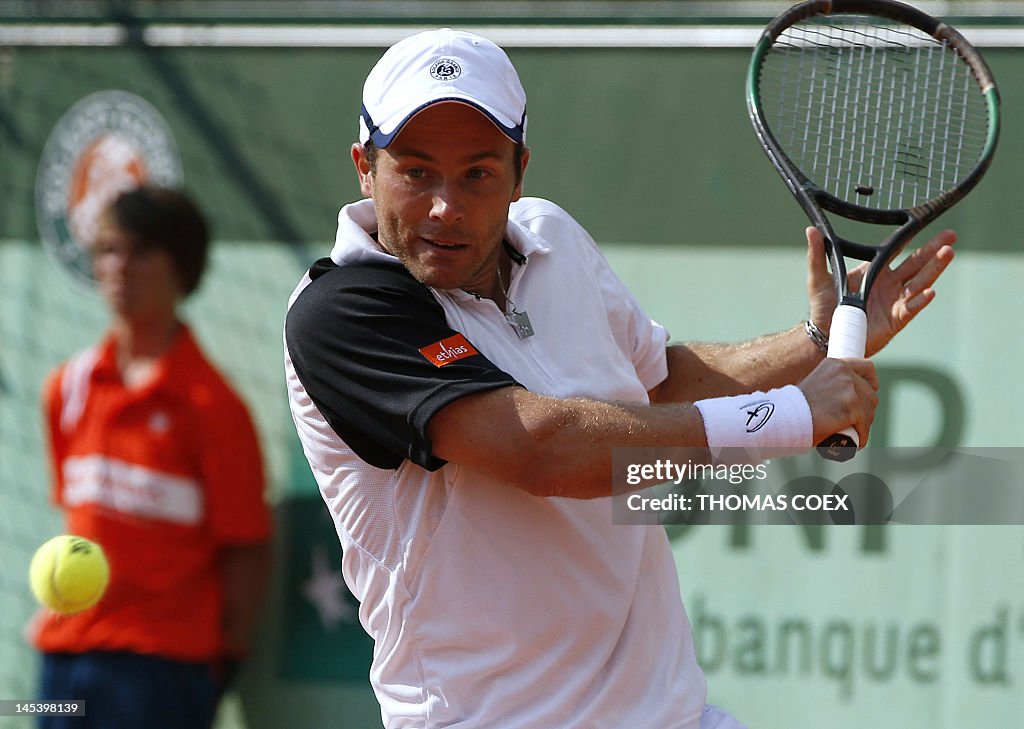 Oliver Rouch Belgium's Olivier Rochus hits a return to Argentina's Leonardo Mayer ...