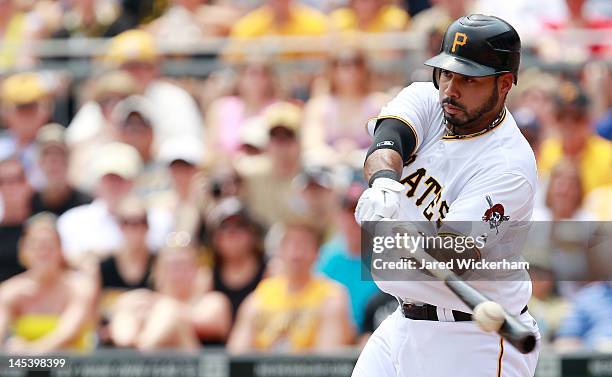 Pedro Alvarez of the Pittsburgh Pirates hits an RBI double in the first inning against the Cincinnati Reds during the game on May 28, 2012 at PNC...