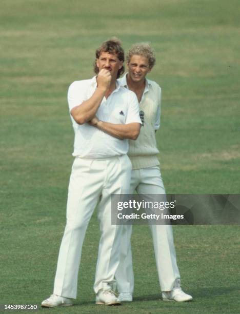 England stand in captain David Gowler talks in the field with Ian Botham during day one of the 2nd Test Match at Lords against Pakistan on August...