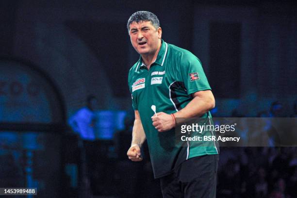 Mensur Suljovic of Austria reacts during Day Seven of the Cazoo World Darts Championship at Alexandra Palace on December 22, 2022 in London, England.