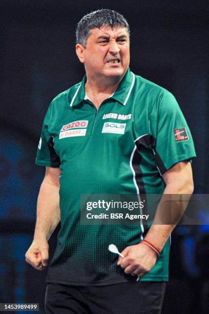 Mensur Suljovic of Austria reacts during Day Seven of the Cazoo World Darts Championship at Alexandra Palace on December 22, 2022 in London, England.