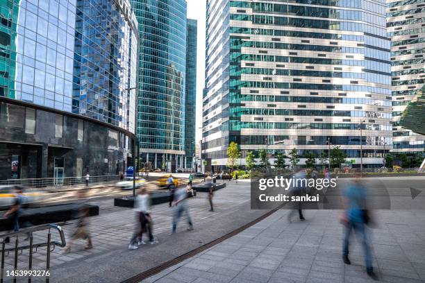 people on the move at the street of modern business quarter - architecture russia bildbanksfoton och bilder