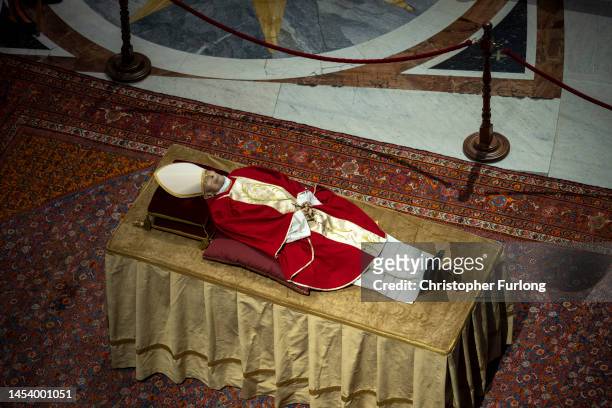 The body of Pope Emeritus Benedict XVI lies in state at St. Peter's Basilica on January 03, 2023 in Vatican City, Vatican. Joseph Aloisius Ratzinger...