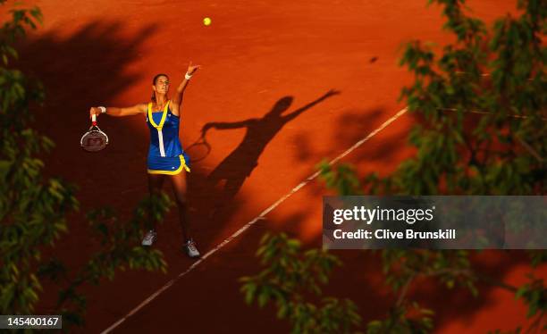 Mandy Minella of Luxembourg serves in the women's singles first round match between Yaroslava Shvedova of Kazakhstan and Mandy Minella of Luxembourg...