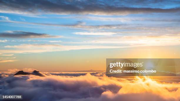 sunrise in high mountain - aerial view of clouds and earth landscape stock pictures, royalty-free photos & images