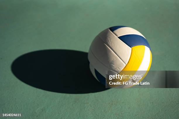 volleyball ball at the sports court - volleyball player stock pictures, royalty-free photos & images