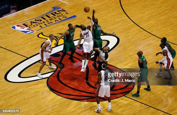 Kevin Garnett of the Boston Celtics fights for control of the opening tip-off against Ronny Turiaf of the Miami Heat in Game One of the Eastern...