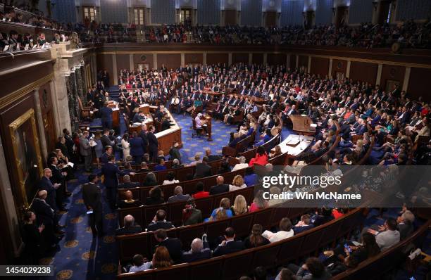 Members of the House of Representatives participate in the vote for Speaker on the first day of the 118th Congress in the House Chamber of the U.S....