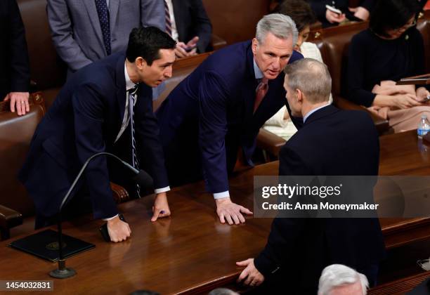 House Minority Leader Kevin McCarthy talks to Rep. Jim Jordan as Representatives cast their votes for Speaker of the House on the first day of the...