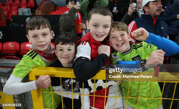 Young Manchester United fans watch from the stand ahead of the Premier League match between Manchester United and AFC Bournemouth at Old Trafford on...