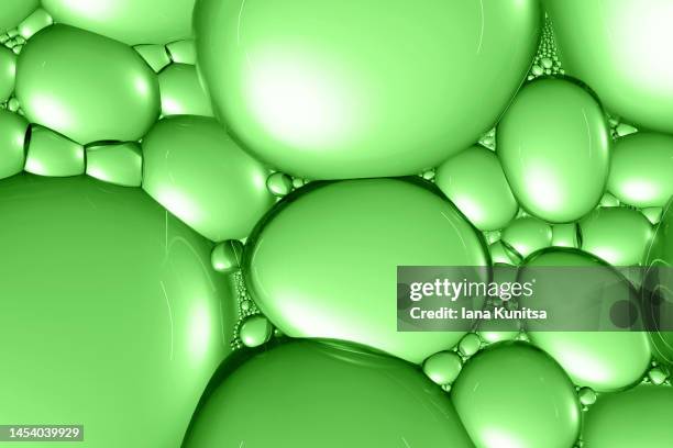 green molecules. 3d bubbles pattern. digital generated image. - organic chemistry in laboratory fotografías e imágenes de stock