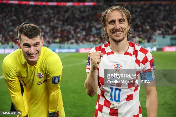 Luka Modric of Croatia and Dominik Livakovic of Croatia celebrate after the team's victory during the FIFA World Cup Qatar 2022 3rd Place match...