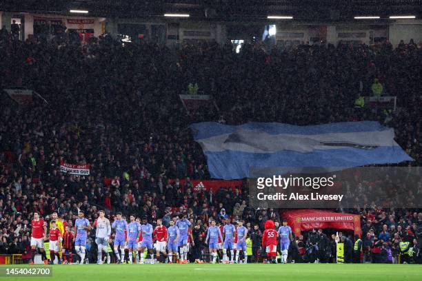 General view as players of Manchester United and AFC Bournemouth walk out of the tunnel, as supporters hold an Argentina flag with a Butchers Knife...