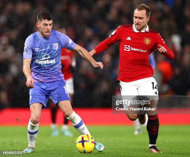 Ryan Christie of AFC Bournemouth is challenged by Christian Eriksen of Manchester United during the Premier League match between Manchester United...