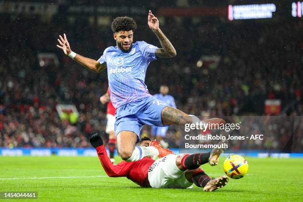 Casemiro of Manchester United slides in to stop Philip Billing of Bournemouth during the Premier League match between Manchester United and AFC...