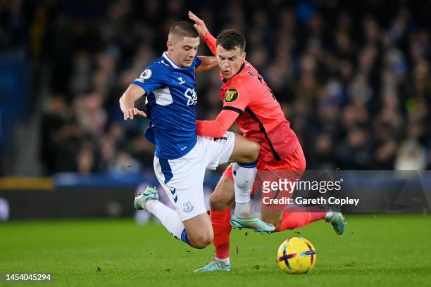 Vitaliy Mykolenko of Everton is challenged by Solly March of Brighton & Hove Albion during the Premier League match between Everton FC and Brighton &...