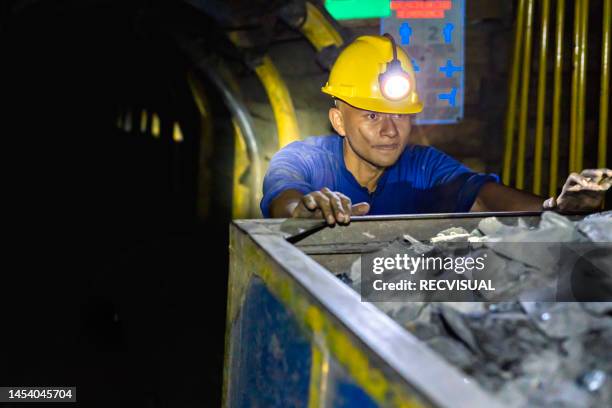 miner in a subway coal mine. - coal miner stock pictures, royalty-free photos & images