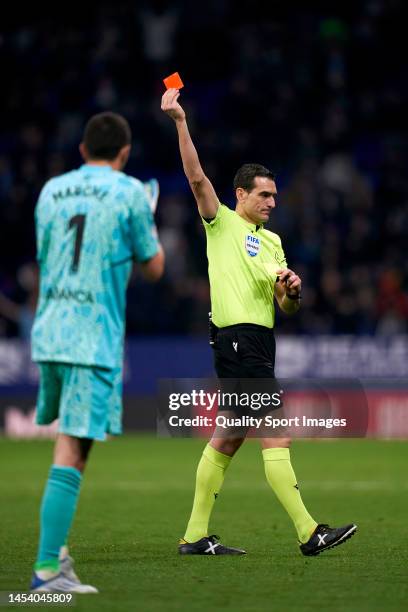 Referee Juan Martinez Munuera show the red card to Agustin Marchesin of RC Celta de Vigo during the Copa del Rey Round of 32 match between RCD...