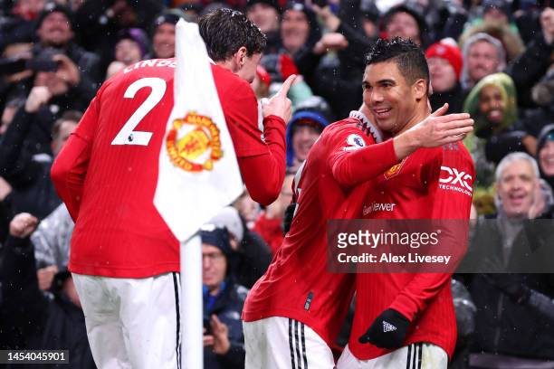 Casemiro of Manchester United celebrates after scoring the team's first goal with teammates during the Premier League match between Manchester United...
