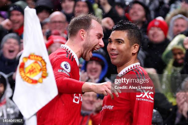 Casemiro of Manchester United celebrates after scoring the team's first goal with teammate Christian Eriksen during the Premier League match between...