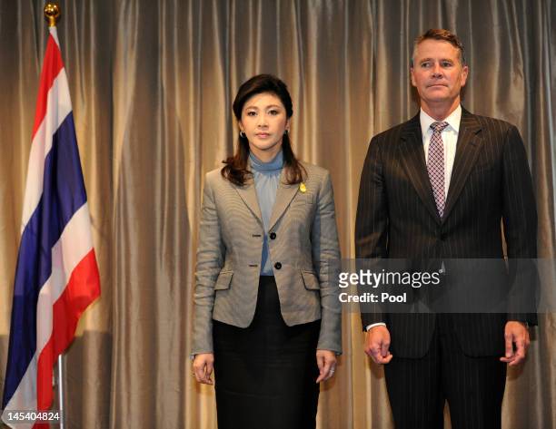 Thai Prime Minister, Ms Yingluck Shinawatra and Deputy Premier of New South Wales Andrew Stoner, stand for the national anthems during the State...