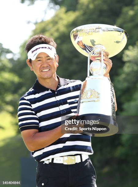 Hiroyuki Fujita poses for photographs with the trophy after winning the Diamond Cup 2012 at The Country Club Japan on May 27, 2012 in Kisarazu, Japan.