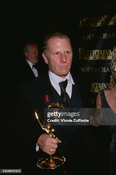 Gordon Clapp holds his Emmy Award at the 3rd Annual Post-Emmy Bash at Cicada Rest in Los Angeles, California, United States, 13th September 1998.