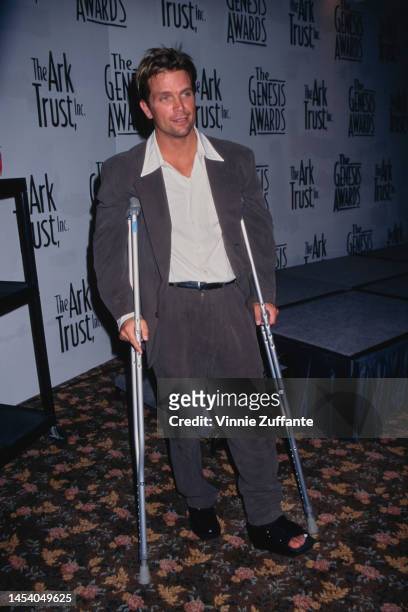 David Chokachi on crutches stands at the Genesis Awards in Los Angeles, California, United States, 5th April 1997.