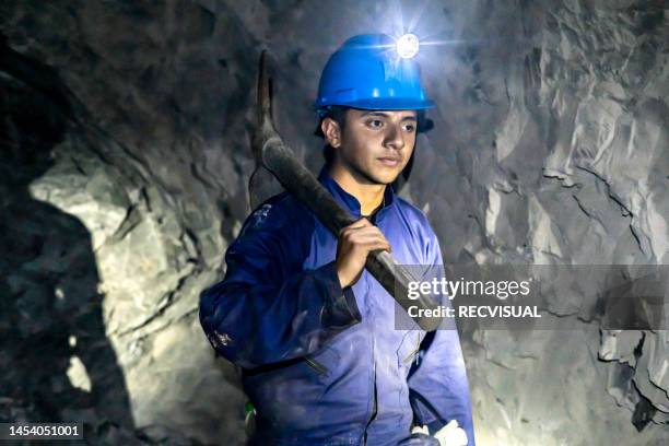 portrait of a miner working in a subway coal mine. - coal miner stockfoto's en -beelden