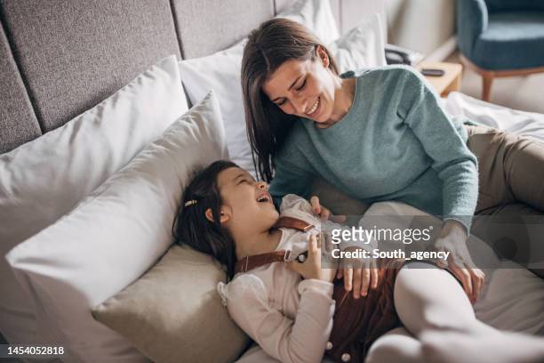 mother and daughter in hotel room - luxury family stock pictures, royalty-free photos & images