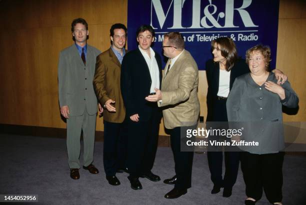 Drew Carey poses with others next to a sign that reads "MT&R The Museum of Television and Radio" in Los Angeles, California, United States, circa...