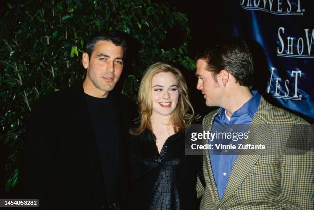 George Clooney, Alicia Silverstone and Chris O'Donnell attend the 1997 NATO/ShoWest Convention at MGM Grand Hotel & Casino in Las Vegas, Nevada,...