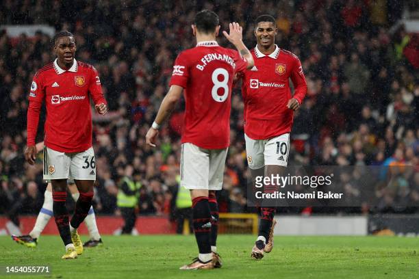 Marcus Rashford of Manchester United celebrates after scoring the team's third goal with teammates during the Premier League match between Manchester...