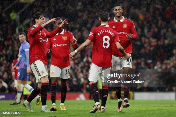 Marcus Rashford of Manchester United celebrates after scoring the team's third goal with teammates during the Premier League match between Manchester...