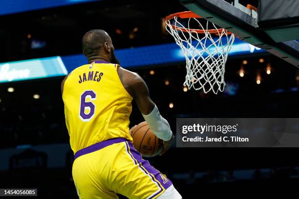 LeBron James of the Los Angeles Lakers dunks during the second half of the game against the Charlotte Hornets at Spectrum Center on January 02, 2023...