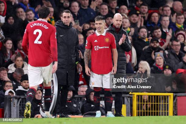 Victor Lindelof of Manchester United leaves the field as they are replaced by Lisandro Martinez, as Erik ten Hag, Manager of Manchester United, looks...